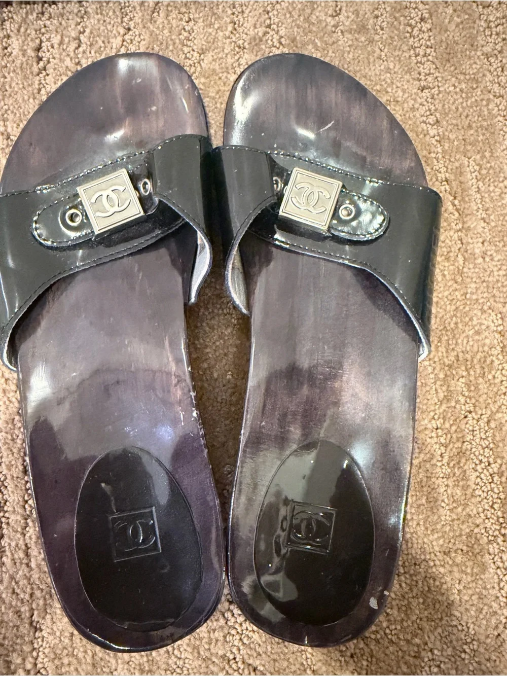 CHANEL Black Patent Leather Slide Mules with Silver Logo Plaque
